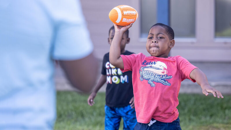 Patient Kainan Bowser playing football
